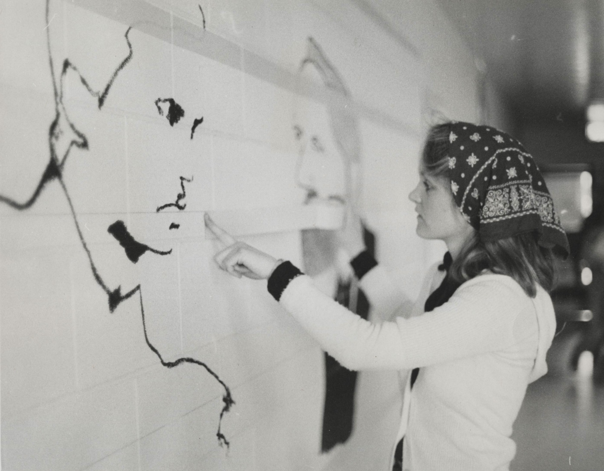 Student working on William James College mural.